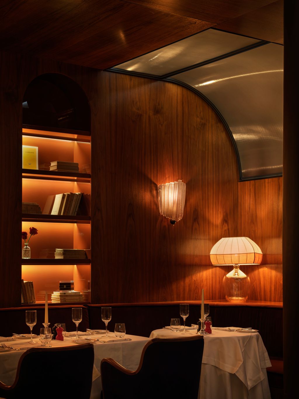 Image may contain Indoors Interior Design Lamp Chair Furniture Cup Wood Dining Table Table Candle and Restaurant