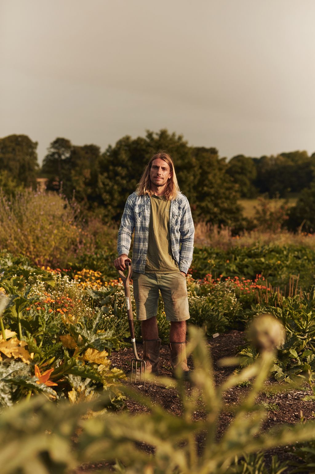 Image may contain Garden Nature Outdoors Person Gardening Gardener Clothing Footwear Shoe Walking and Device