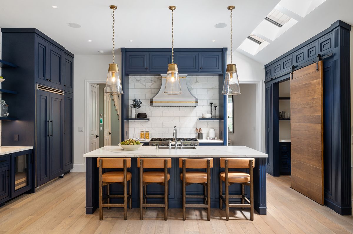 Image may contain Indoors Interior Design Kitchen Kitchen Island Architecture Building Dining Room and Dining Table