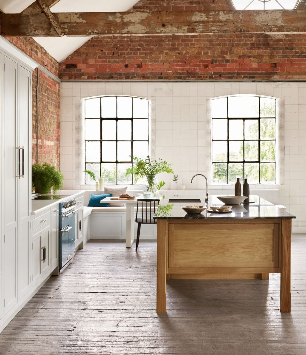 Image may contain Indoors Interior Design Kitchen Sink Sink Faucet Kitchen Island and Plant