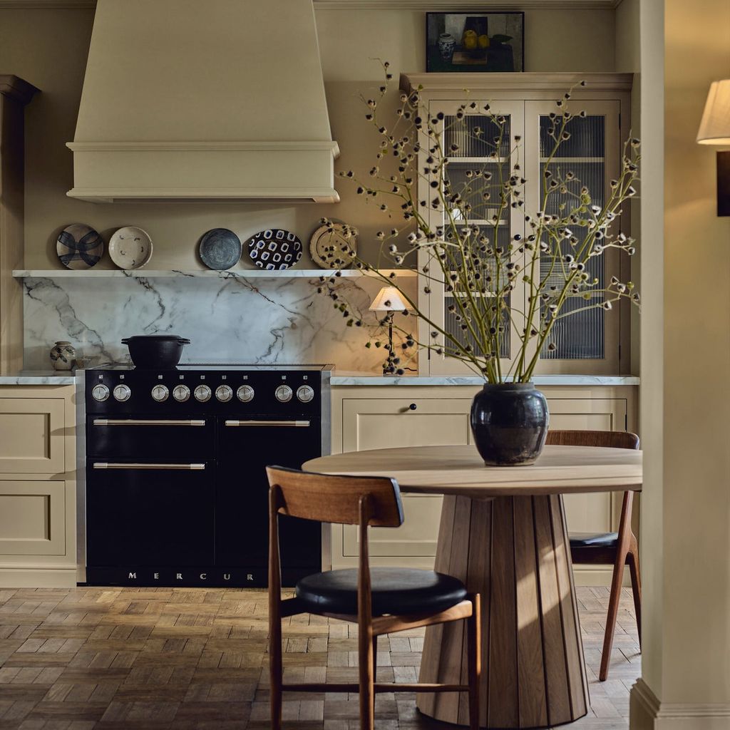 Image may contain Indoors Interior Design Architecture Building Dining Room Dining Table Furniture Room and Table