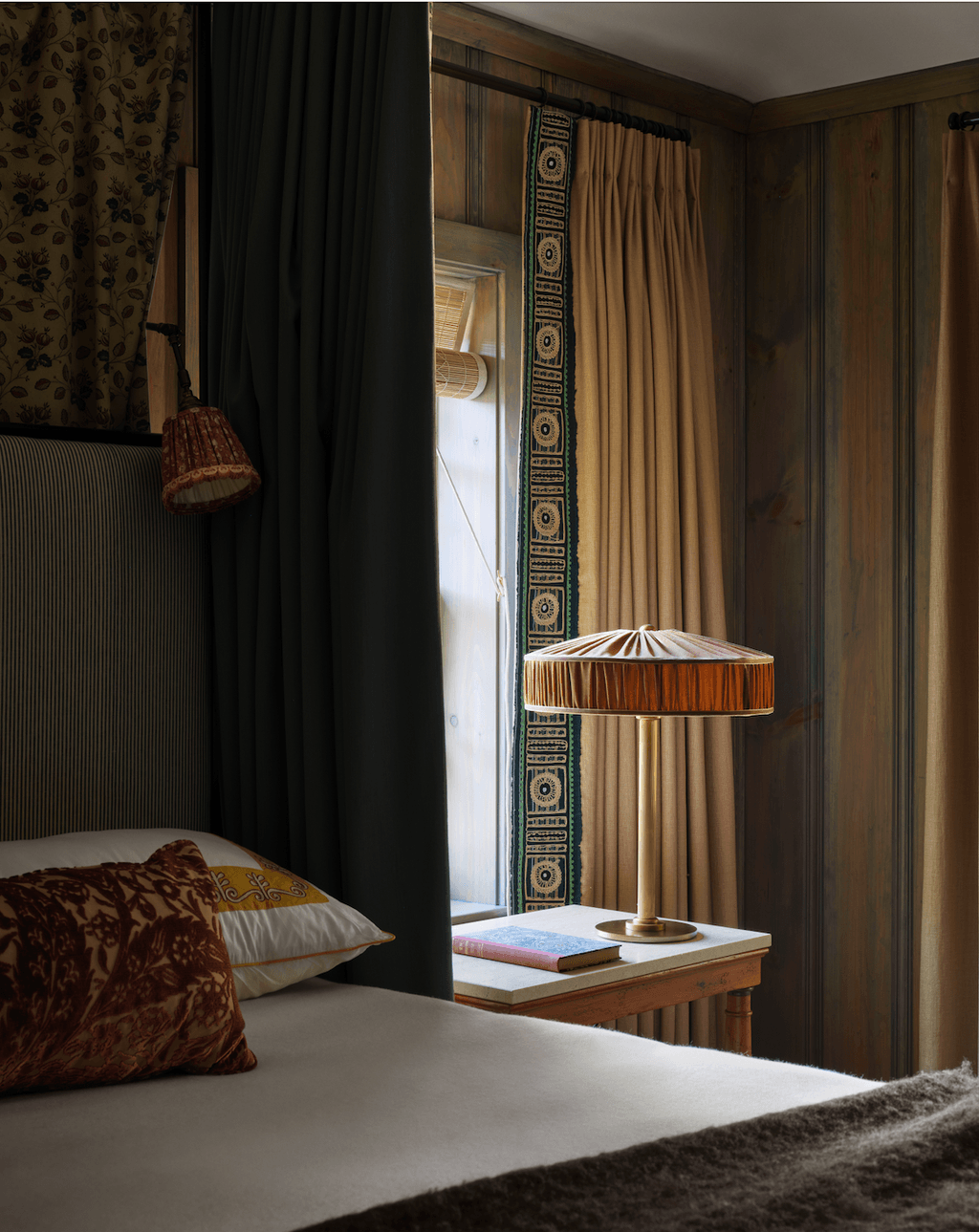 Image may contain Indoors Interior Design Lamp Cushion Home Decor Bed Furniture and Table Lamp