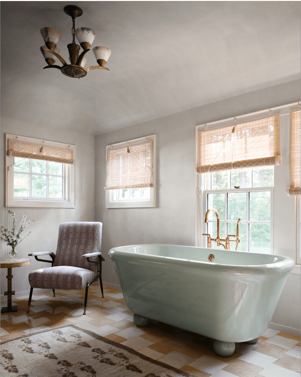 Image may contain Bathing Bathtub Person Tub Indoors Interior Design Home Decor Chair Furniture and Chandelier