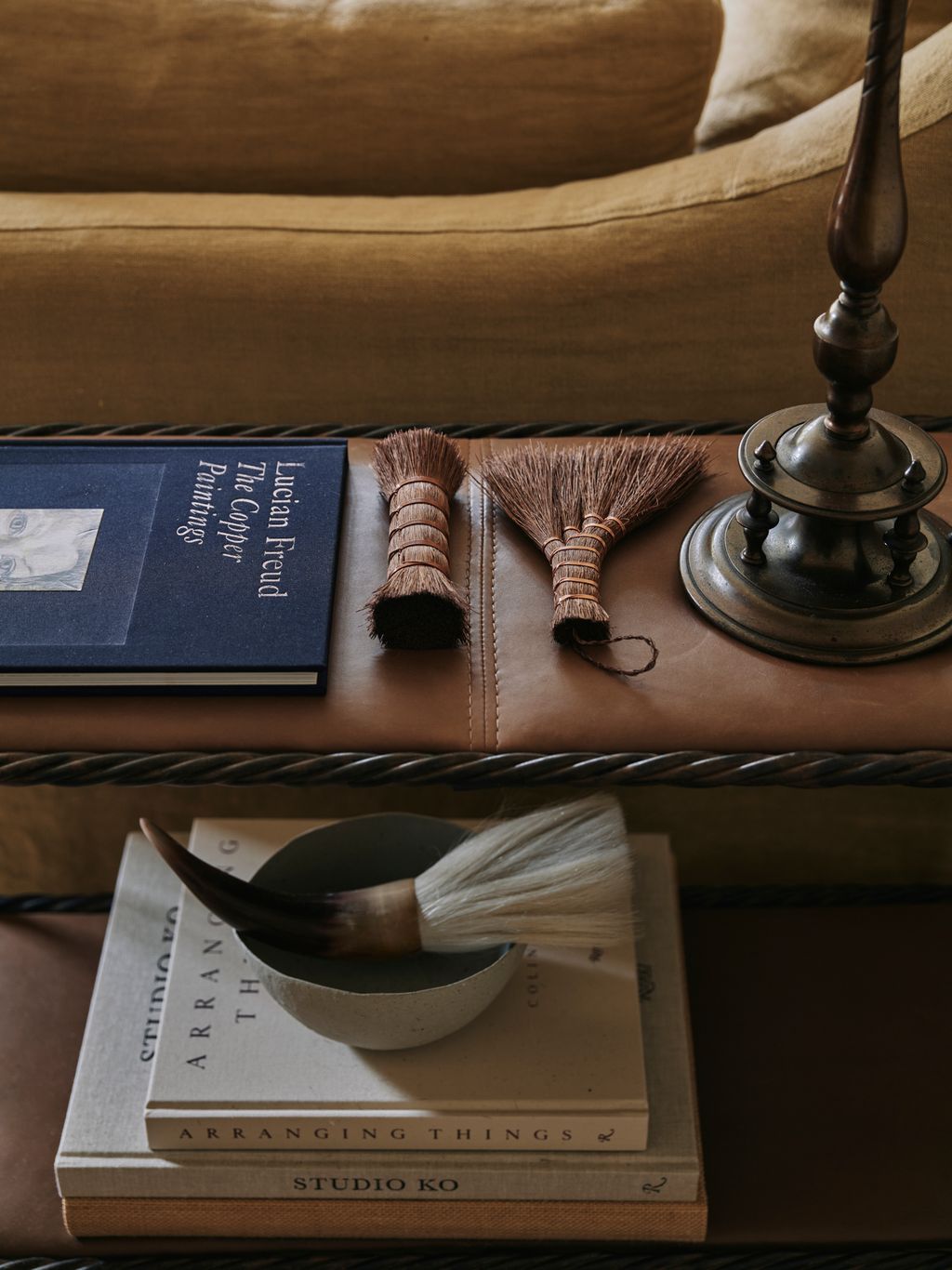 Image may contain Coffee Table Furniture Table Book Publication Couch Brush Device Tool and Indoors