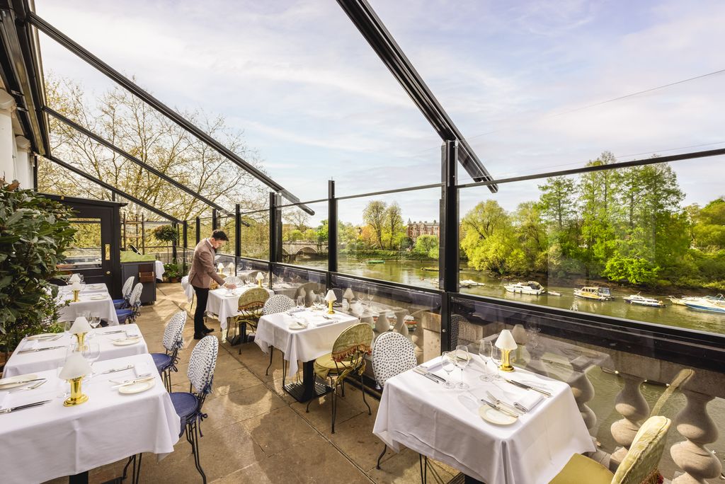 Image may contain Terrace Person Furniture Table Dining Table Lamp Boat Transportation Vehicle and Indoors