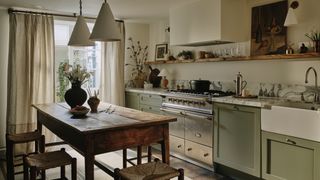 Image may contain Indoors Kitchen Architecture Building Dining Room Dining Table Furniture Room and Table