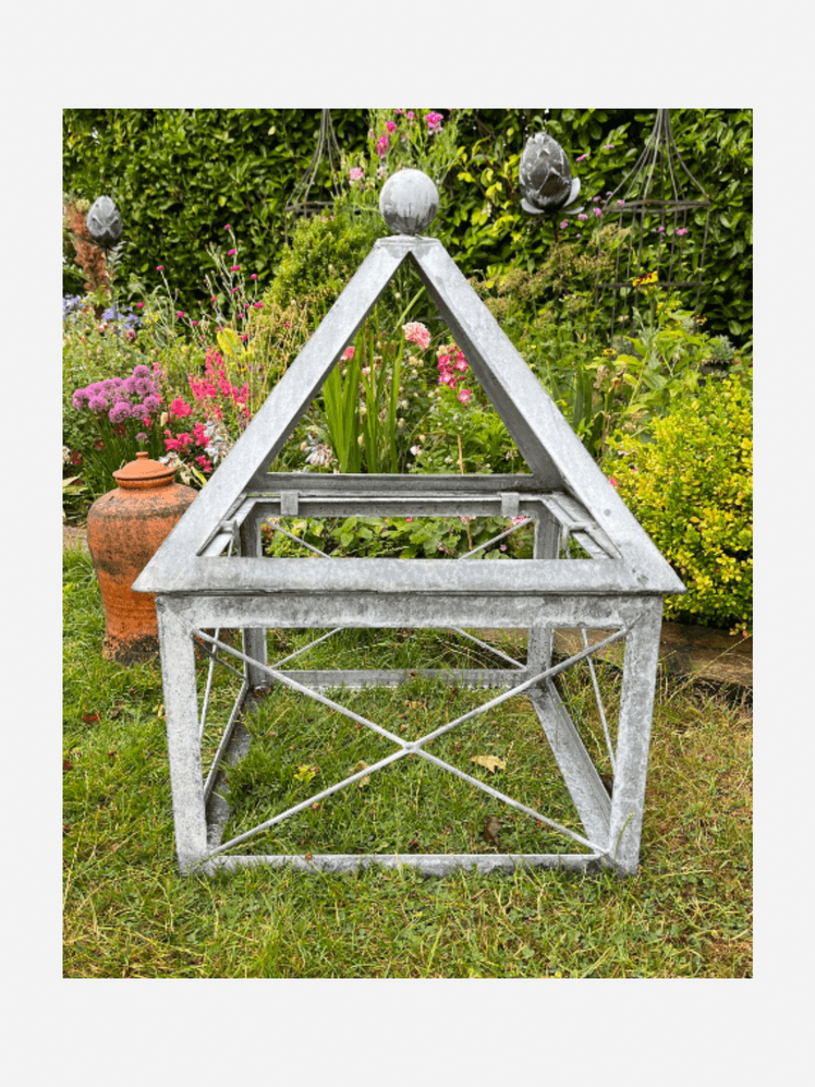 Image may contain: Garden, Nature, Outdoors, Plant, Potted Plant, Jar, Planter, Pottery, Vase, Triangle, Grass, and Flower