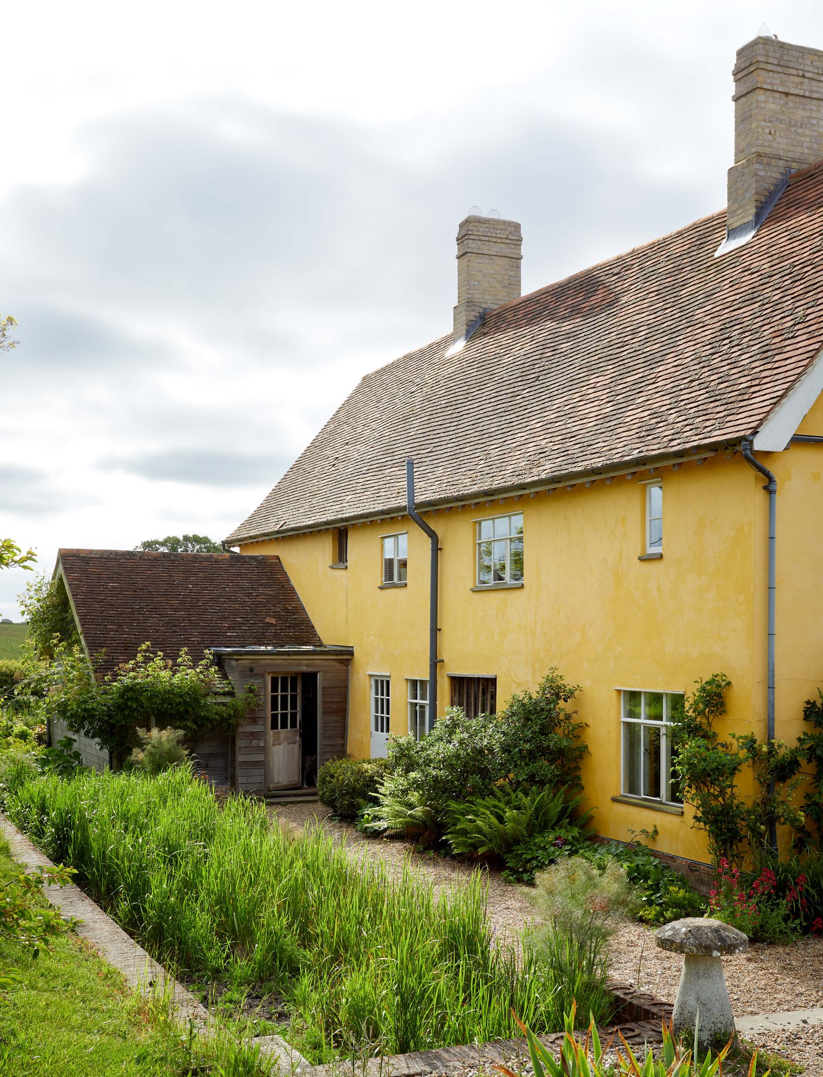 Image may contain Architecture Building Cottage House Housing Fungus Plant and Outdoors