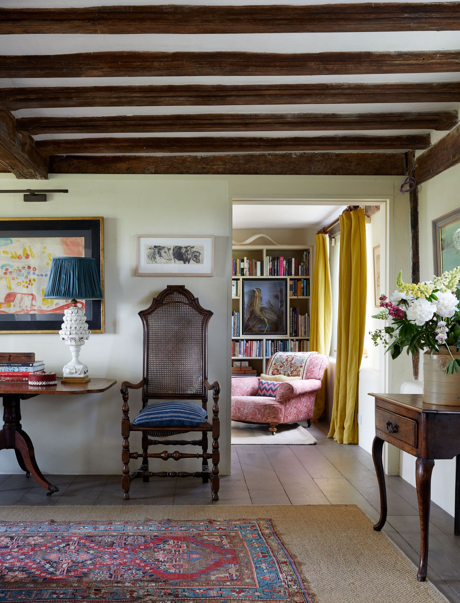 Image may contain Architecture Building Furniture Indoors Living Room Room Lamp Chair Desk and Table