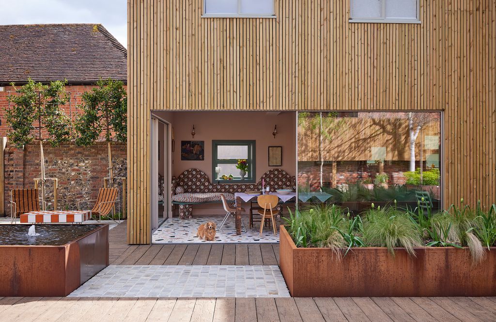 Image may contain Indoors Interior Design Backyard Nature Outdoors Yard Chair Furniture Plant Art and Painting