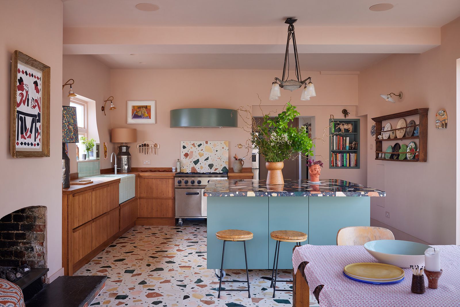 Image may contain Lamp Home Decor Architecture Building Dining Room Dining Table Furniture Indoors Room and Table