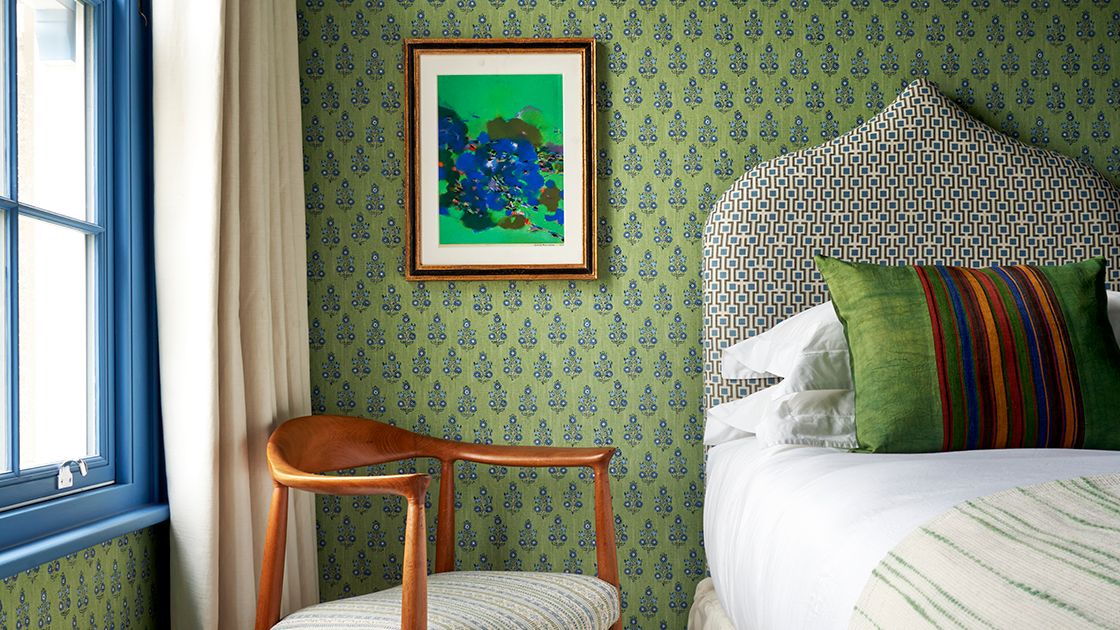 Image may contain: Chair, Furniture, Corner, Art, Painting, Cushion, Home Decor, Bed, Indoors, Interior Design, and Bedroom