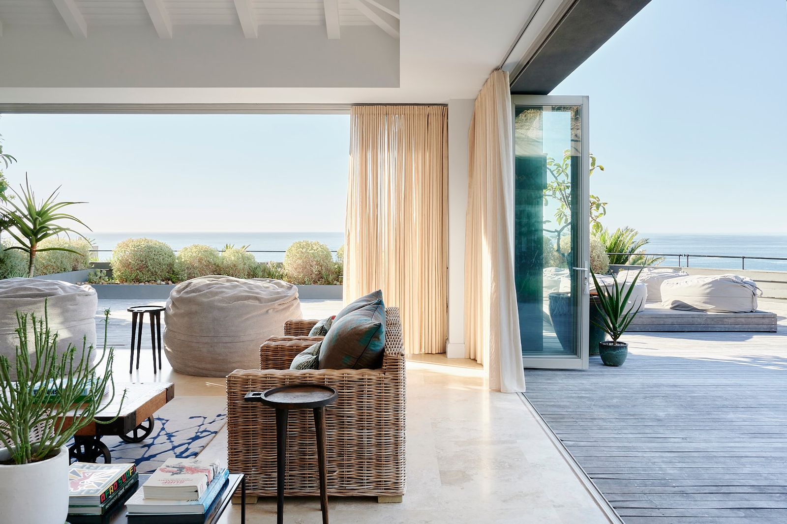 Image may contain Architecture Balcony Building Plant Couch Furniture Home Decor Indoors Living Room and Room