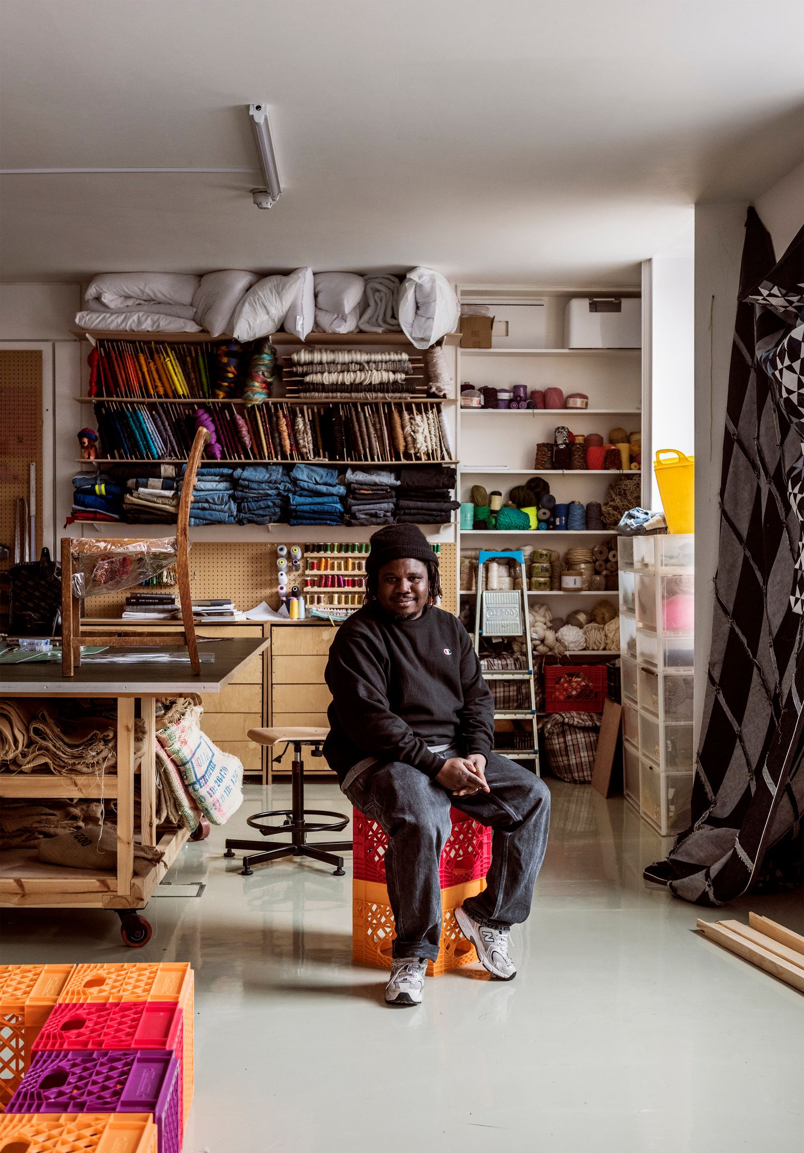 Image may contain Person Sitting Clothing Footwear Shoe Adult Furniture Hat Indoors Lamp Accessories and Bag