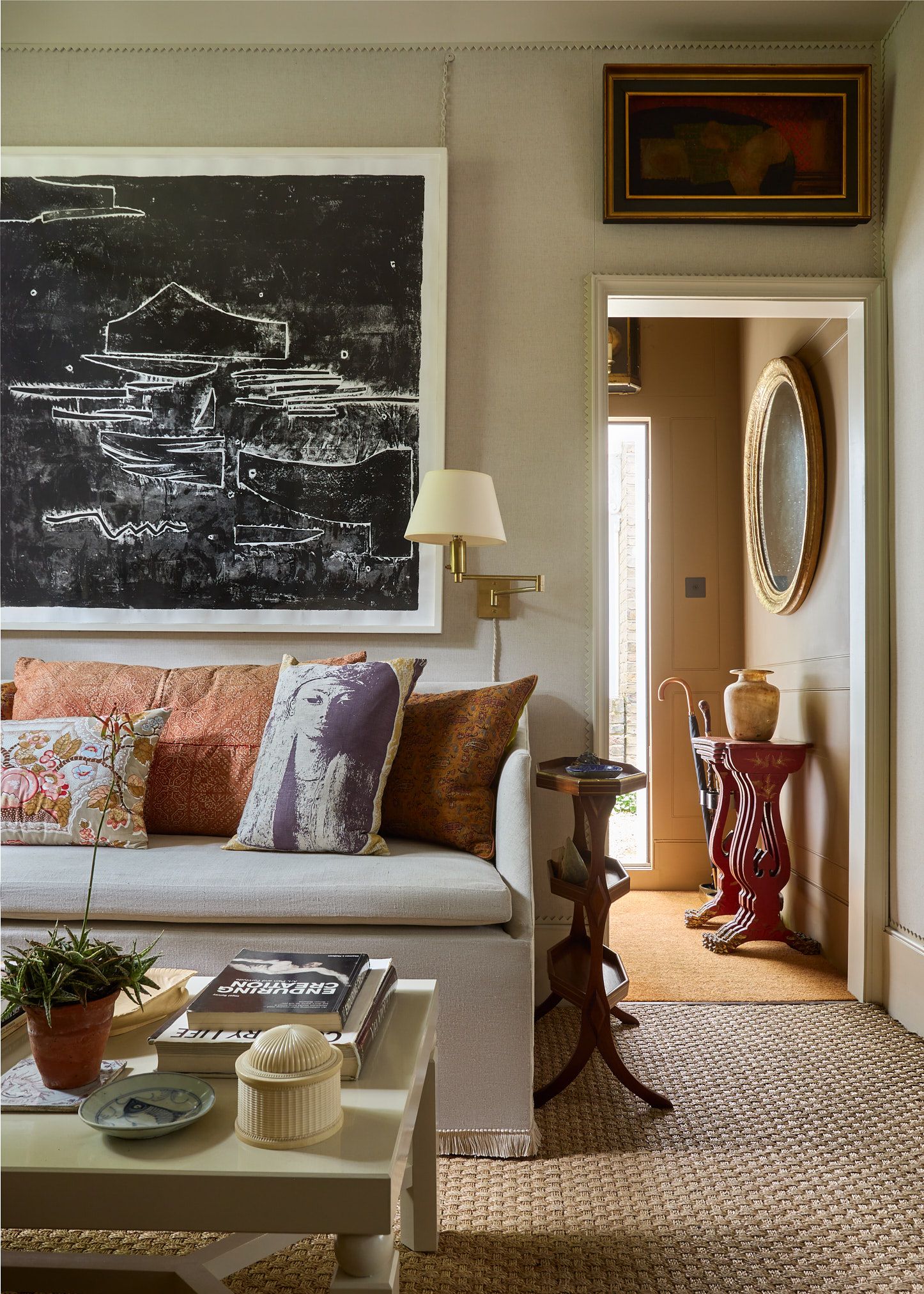 Image may contain Lamp Home Decor Furniture Table Couch Architecture Building Indoors Living Room Room and Cushion