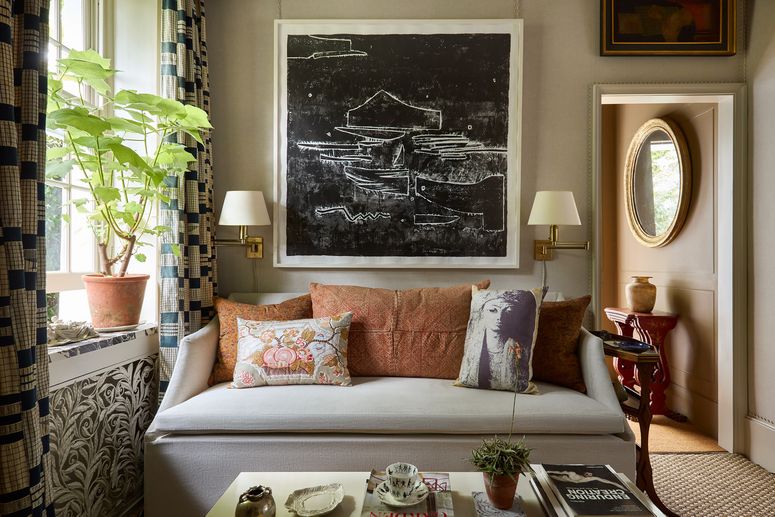 Image may contain: Cushion, Home Decor, Lamp, Plant, Couch, Furniture, Architecture, Building, Indoors, Living Room, and Room