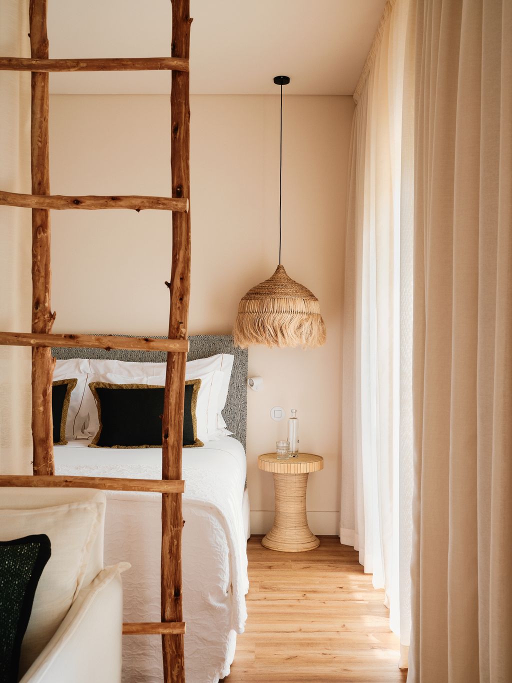 Image may contain Indoors Interior Design Lamp Wood Home Decor Cup Furniture Bed Bedroom and Room