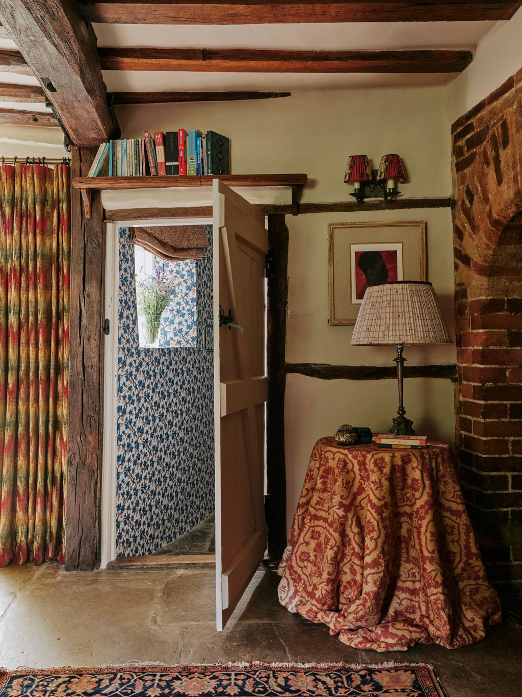 Image may contain Lamp Home Decor Rug Book Publication Art Painting Person Furniture Indoors Desk and Table