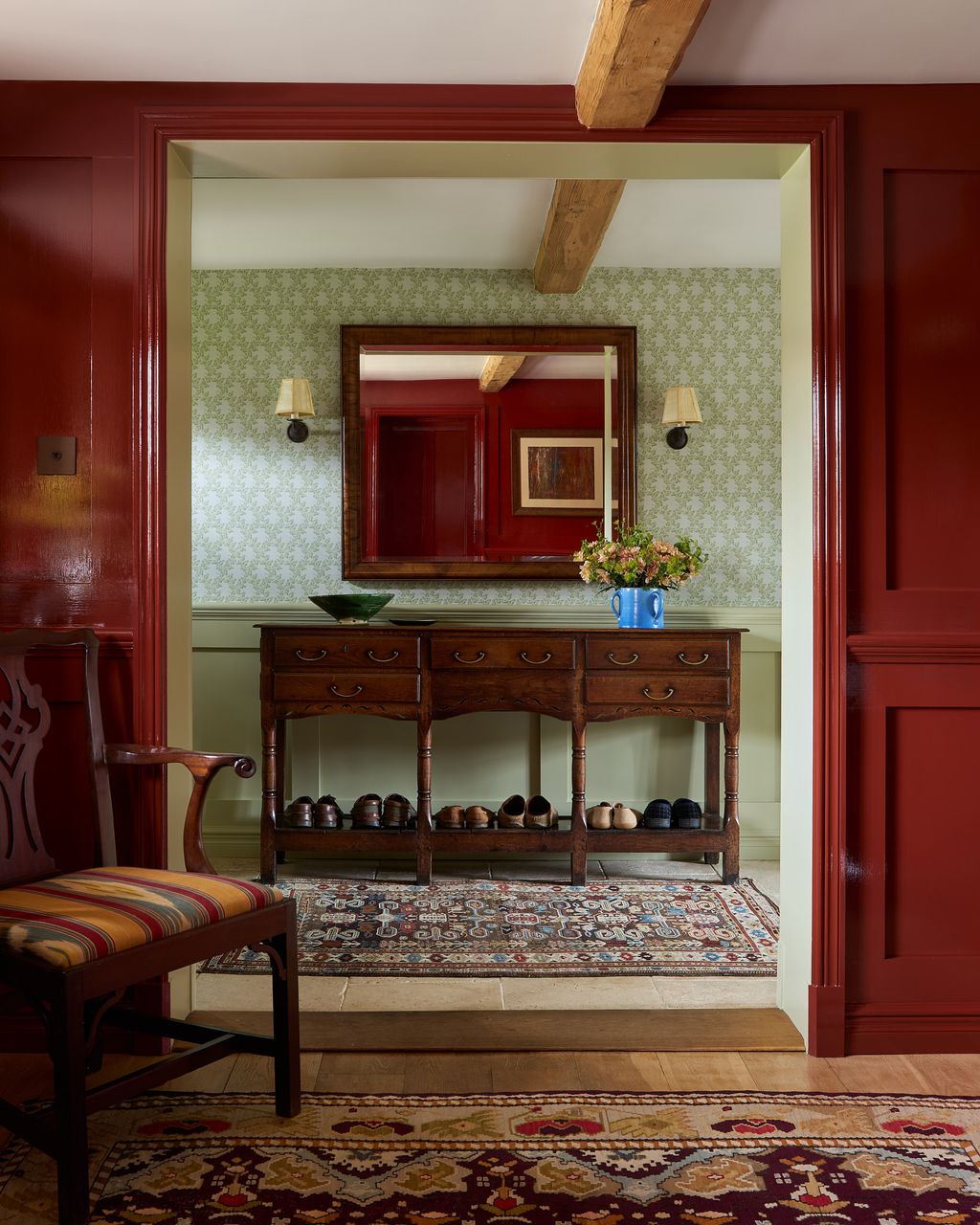 Image may contain Home Decor Indoors Interior Design Rug Lamp Chair Furniture Architecture Building and Living Room