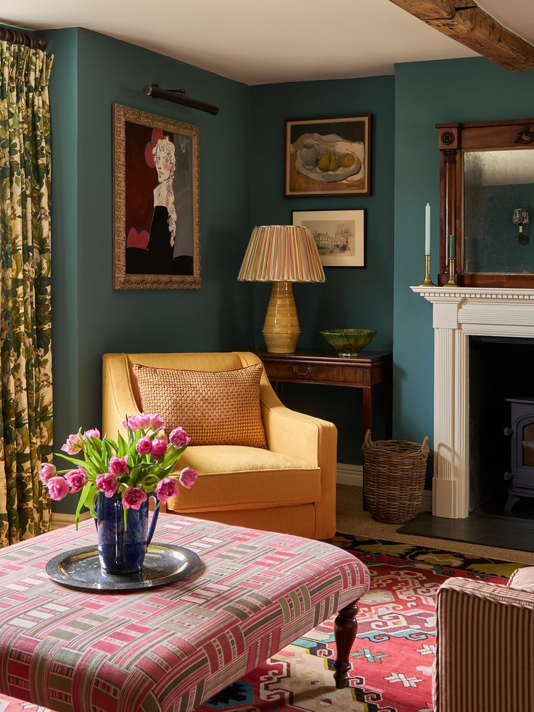 Image may contain: Lamp, Art, Painting, Home Decor, Furniture, Chair, Rug, Candle, Architecture, Building, and Indoors