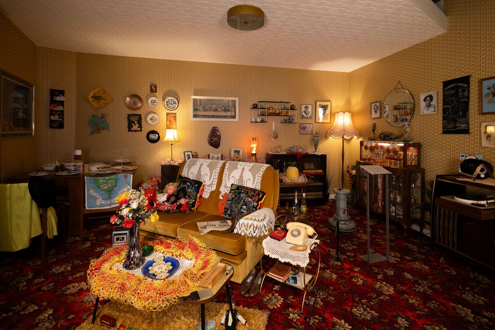 Image may contain Home Decor Architecture Building Furniture Indoors Living Room Room Couch Lamp Person and Art