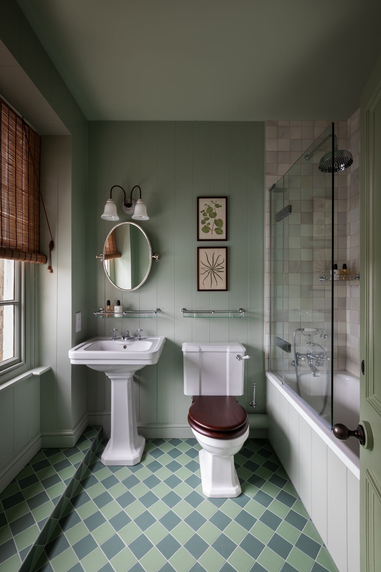 Image may contain Corner Bathroom Indoors Room Toilet Sink Sink Faucet Bathing Bathtub Person Tub and Art