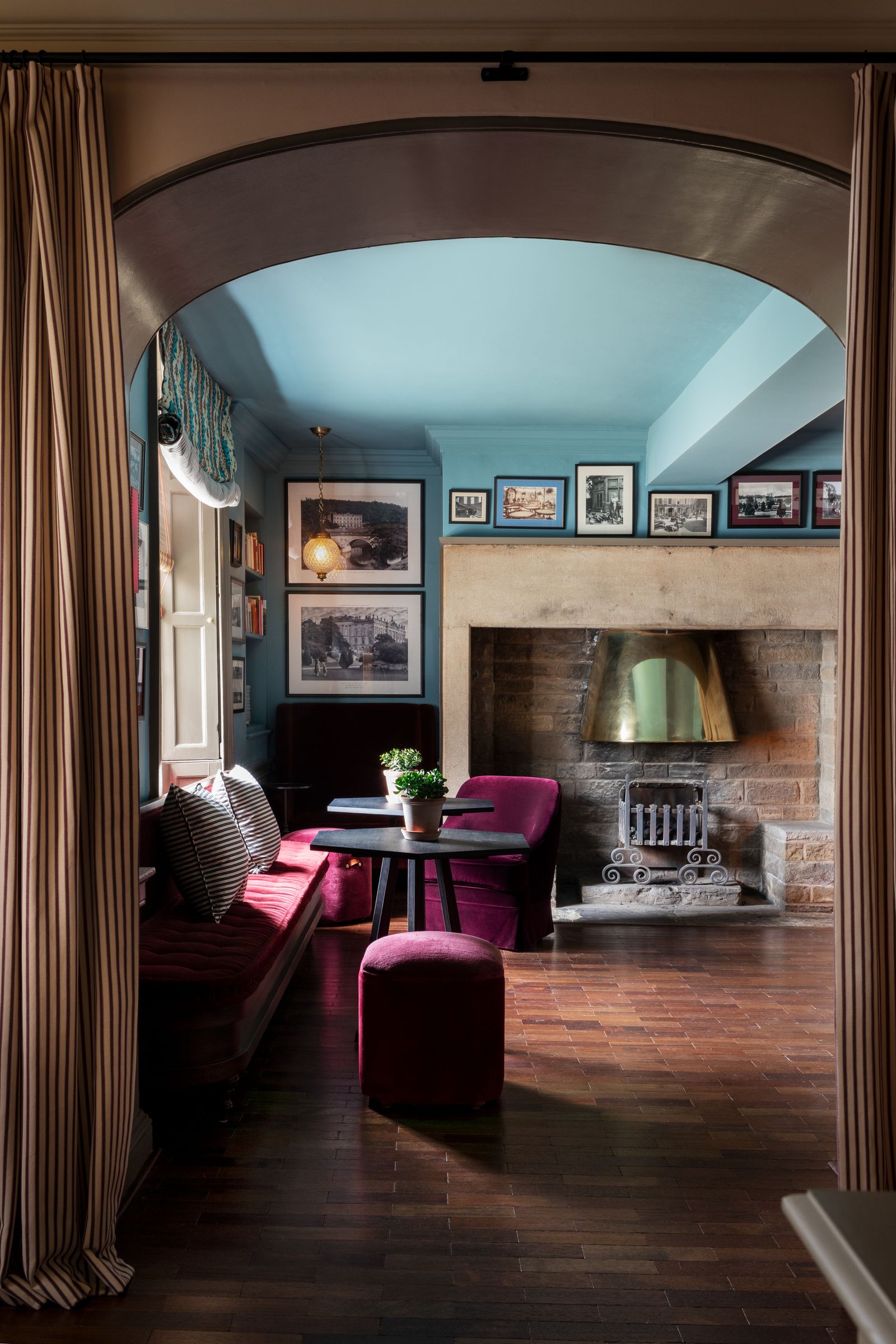 Image may contain Architecture Building Furniture Indoors Living Room Room Floor Flooring Couch and Interior Design