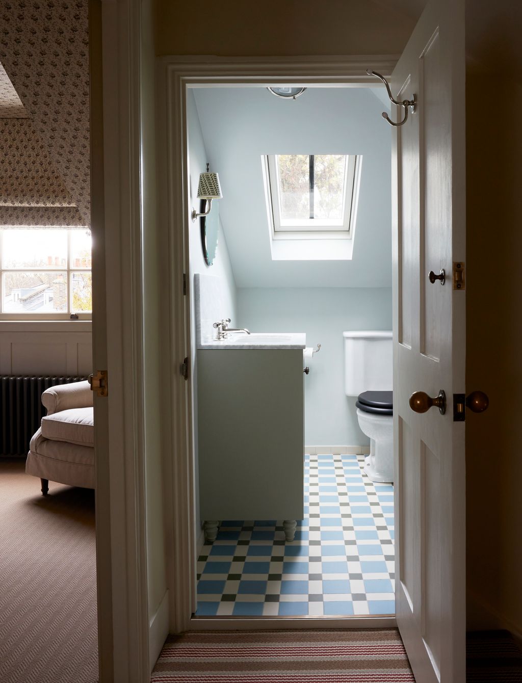 Image may contain Floor Home Decor Rug Couch Furniture Indoors Bathroom Room Toilet Flooring and Window