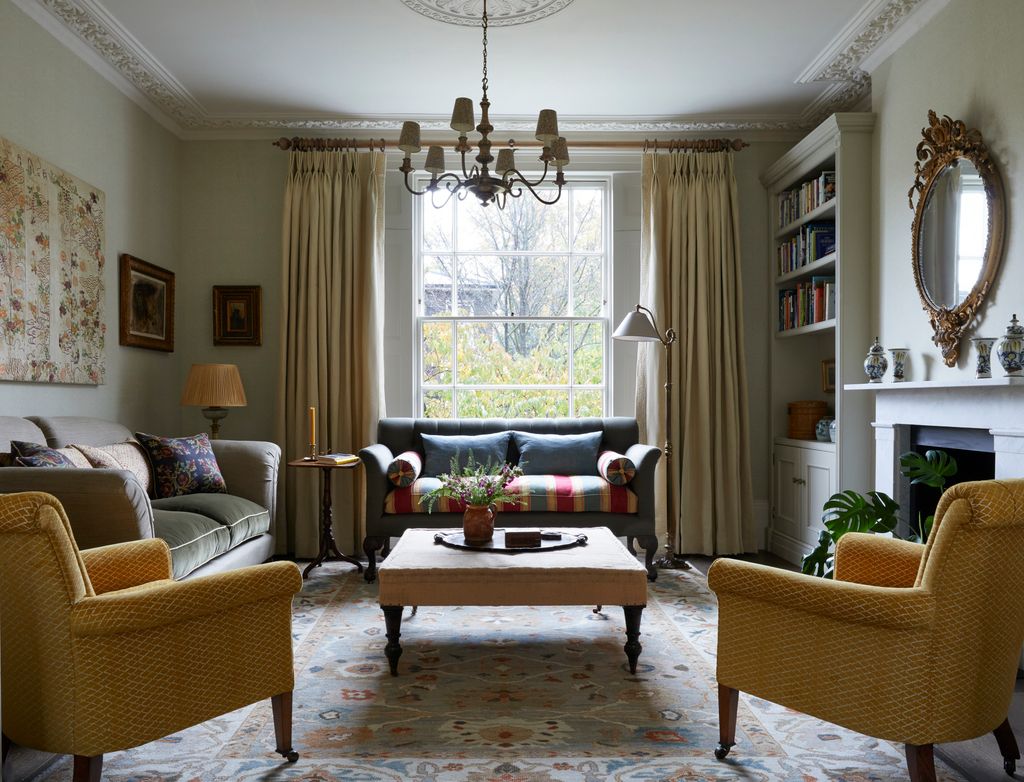 Image may contain Home Decor Lamp Couch Furniture Architecture Building Indoors Living Room Room Art and Painting