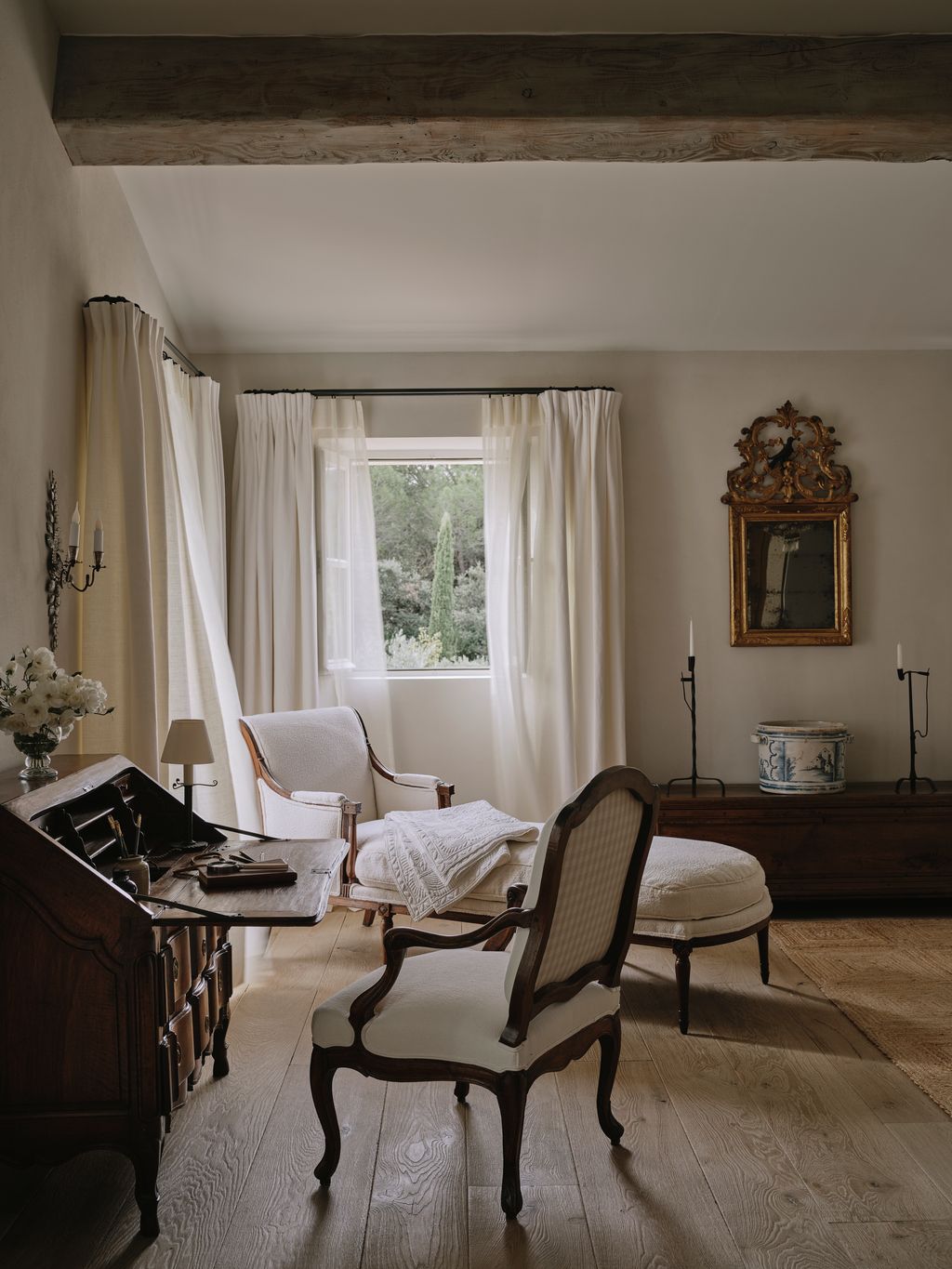 Image may contain Chair Furniture Home Decor Lamp Architecture Building Indoors Living Room and Room