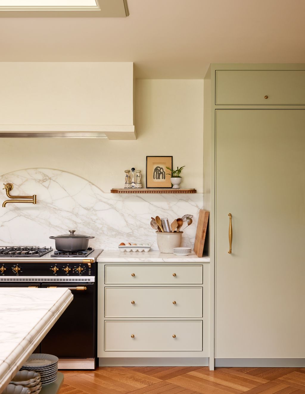 Image may contain Indoors Interior Design Plant Cooktop Kitchen Art Painting Furniture Cup Sink and Sink Faucet