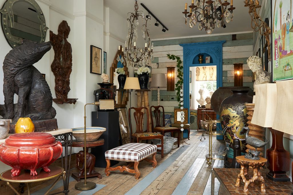 Image may contain Home Decor Chair Furniture Lamp Architecture Building Indoors Living Room Room and Dining Room