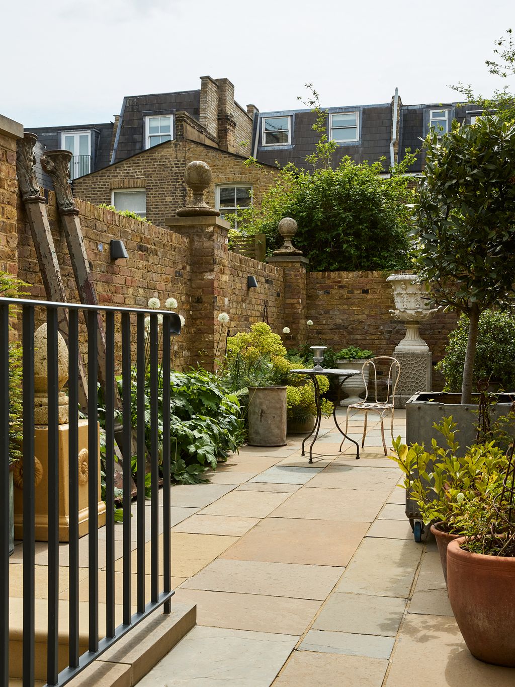 Image may contain Backyard Nature Outdoors Yard Desk Furniture Table Chair Plant Potted Plant and Architecture