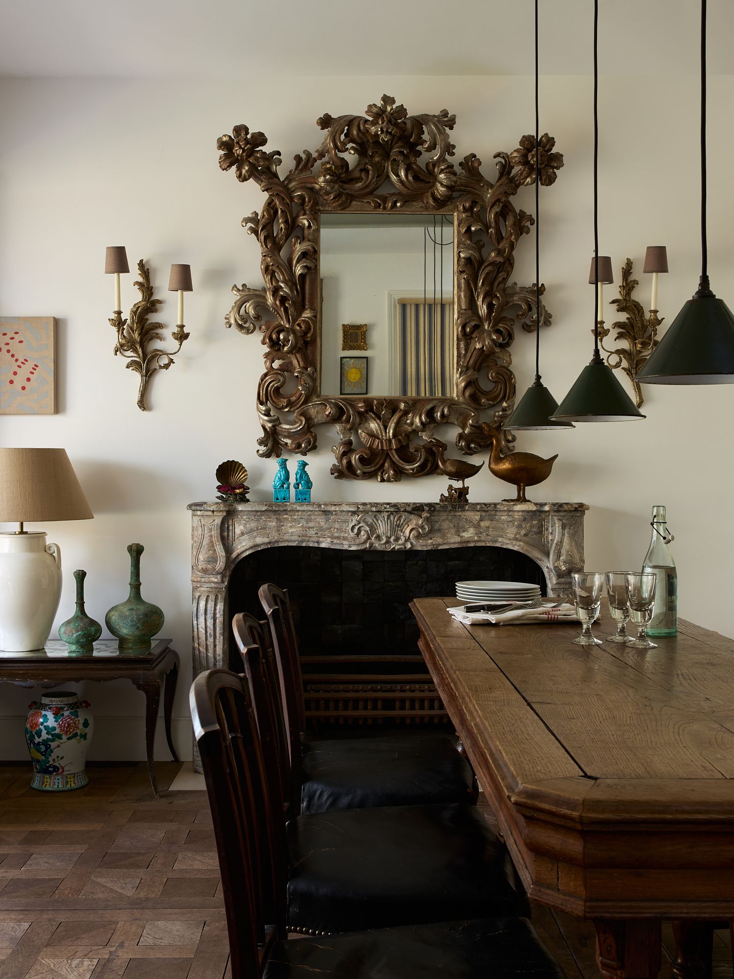 Image may contain Architecture Building Dining Room Dining Table Furniture Indoors Room Table and Lamp