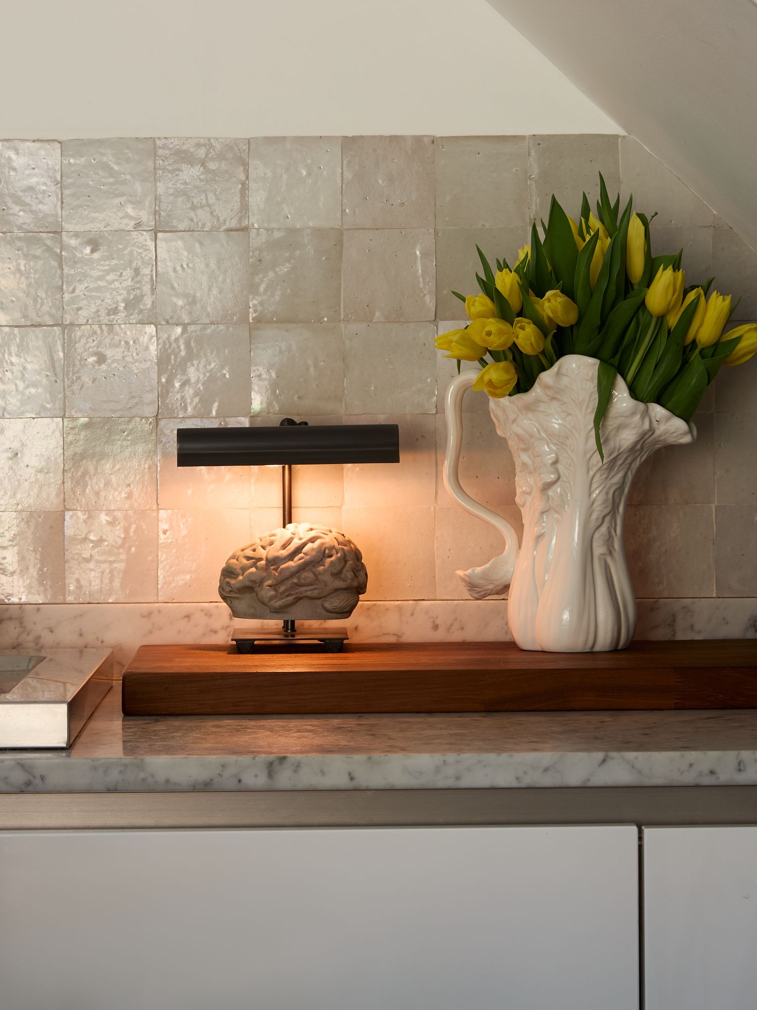 Image may contain Flower Flower Arrangement Plant Window Windowsill Indoors Interior Design Lamp Adult and Person