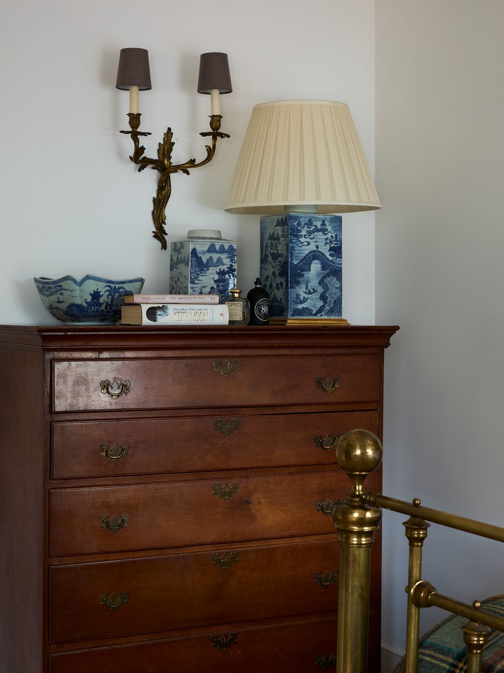 Image may contain Furniture Lamp Box Cabinet Book Publication and Candle