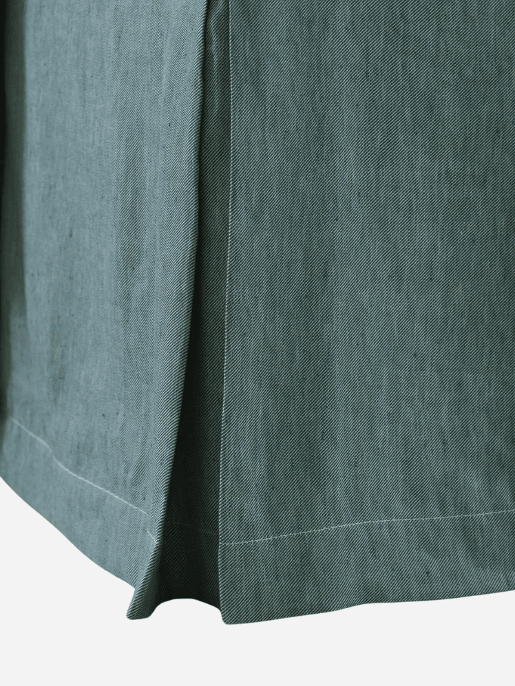 Image may contain: Home Decor, Linen, Tablecloth, Clothing, and Pants