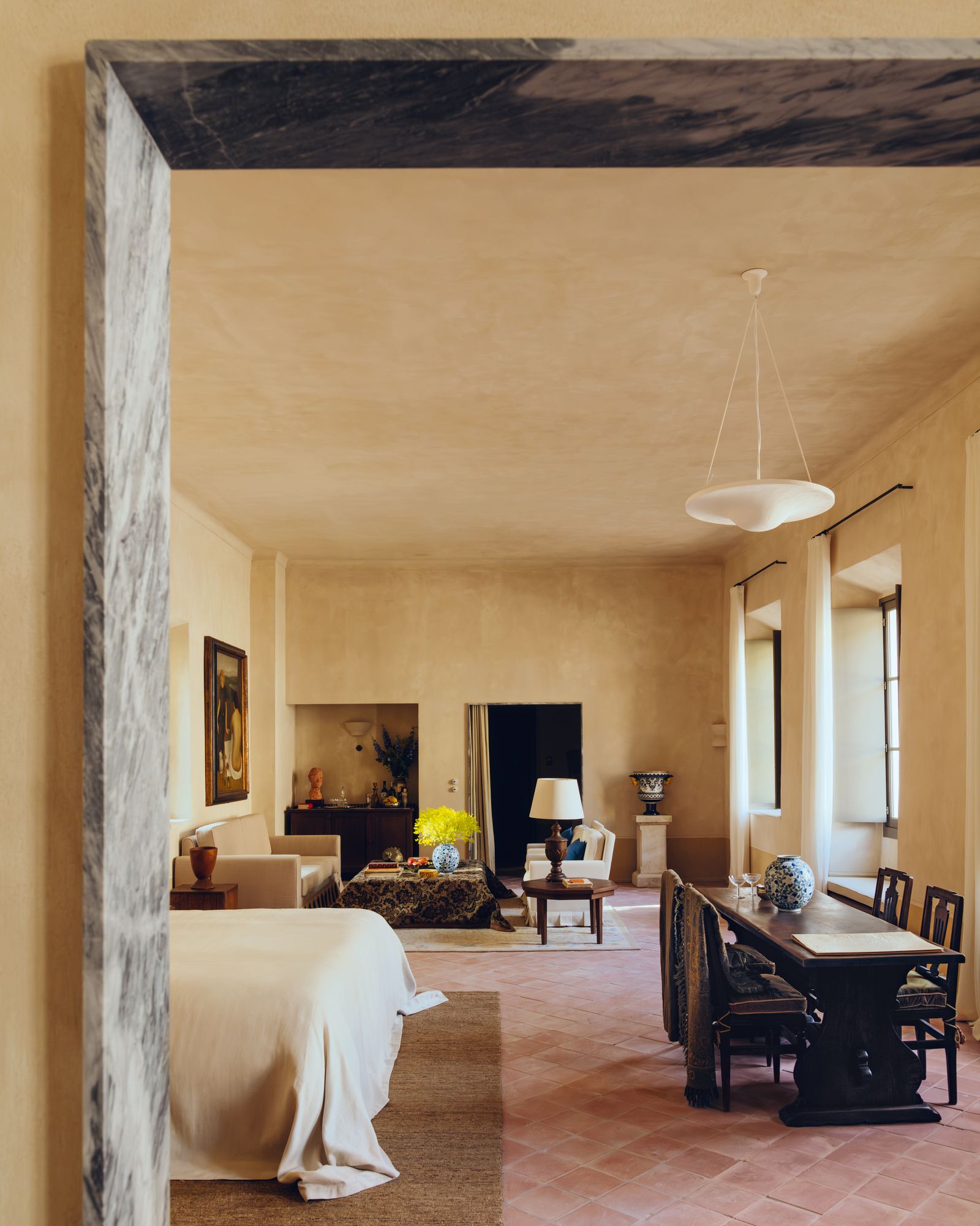 Image may contain Lamp Art Painting Architecture Building Dining Room Dining Table Furniture Indoors and Room