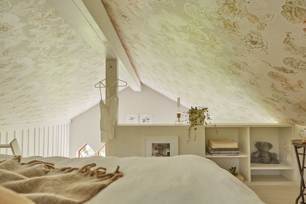 Image may contain Architecture Building House Housing Indoors Loft Room Plant Toy Interior Design and Bed