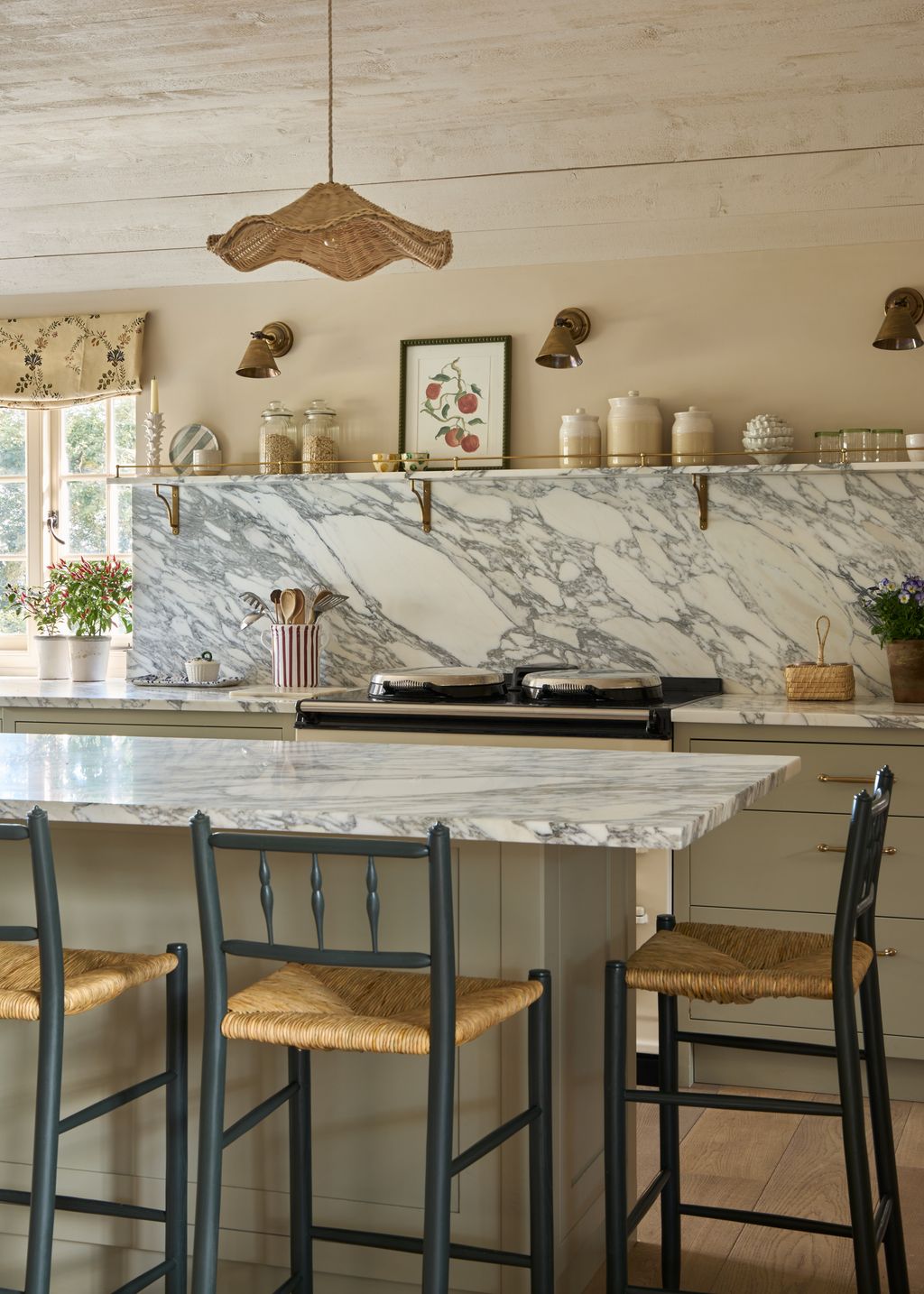 Image may contain Indoors Interior Design Kitchen Lamp Art Painting Chair Furniture Kitchen Island Cup and Candle