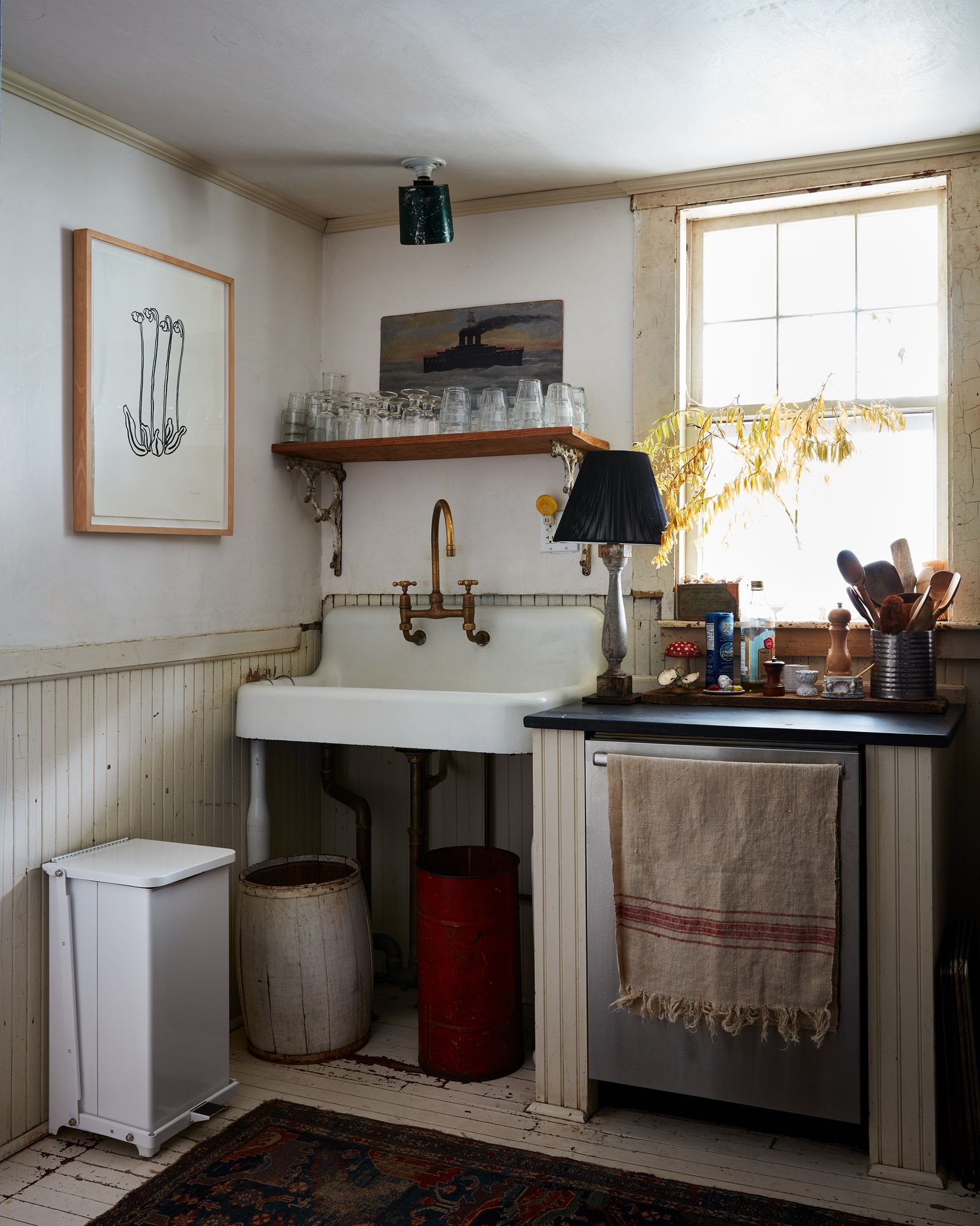 Image may contain Corner Sink Sink Faucet Lamp Indoors Interior Design Home Decor Rug Art Painting and Cup