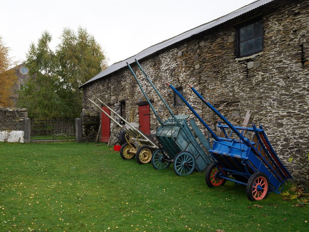 Image may contain Grass Plant Lawn Machine Spoke Architecture Building Outdoors Shelter Transportation and Vehicle