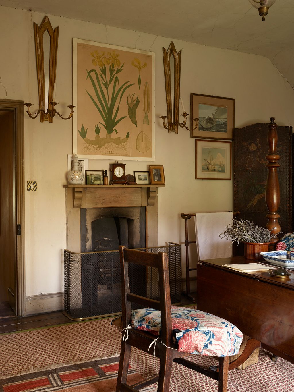 Image may contain Home Decor Indoors Interior Design Chair Furniture Plant Art Painting Lamp and Architecture