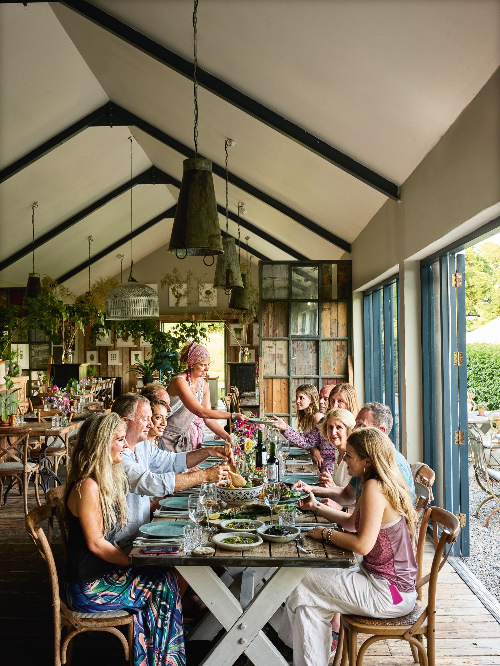 Image may contain Architecture Building Dining Room Dining Table Furniture Indoors Room Table Lamp Chair and Child