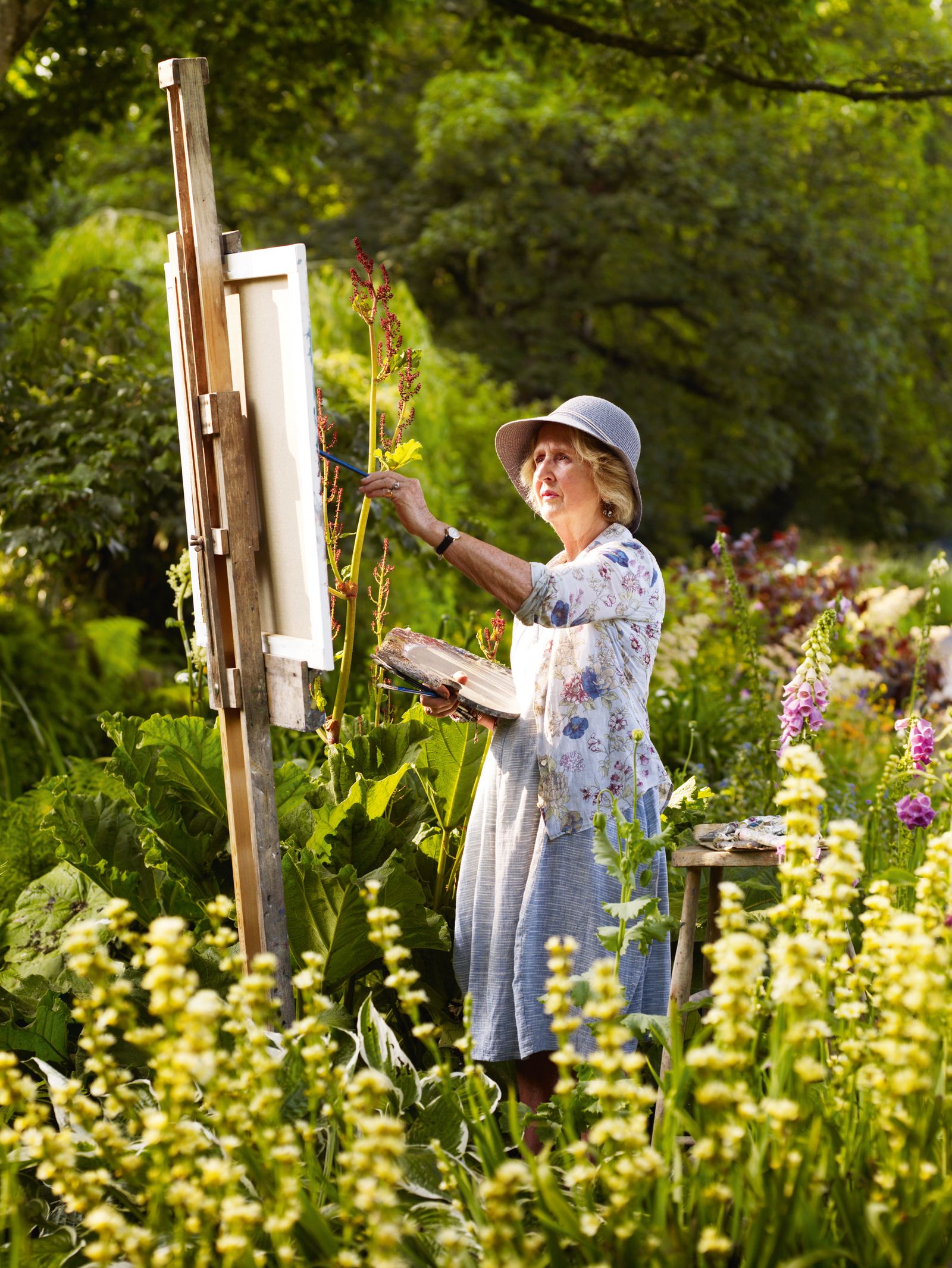 Image may contain Garden Nature Outdoors Child Person Clothing Hat Gardening Wristwatch and Senior Citizen