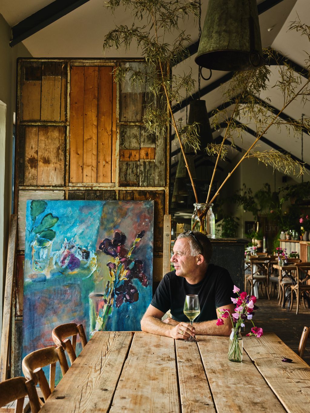 Image may contain Architecture Building Dining Room Dining Table Furniture Indoors Room Table and Plant