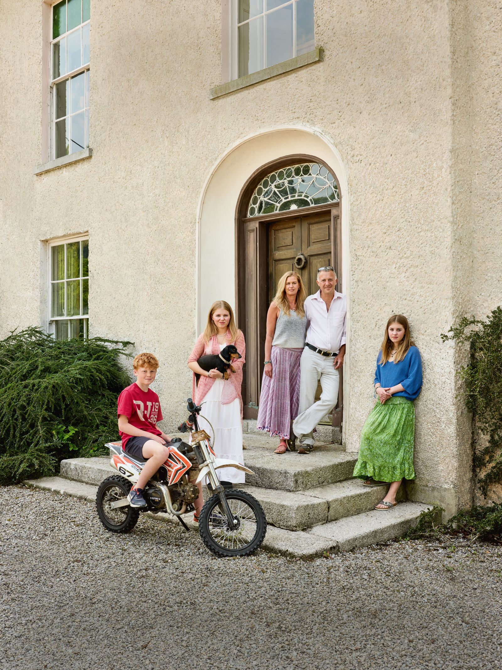 Image may contain Face Head Person Photography Portrait Clothing Dress Skirt City Road Street Urban and Child