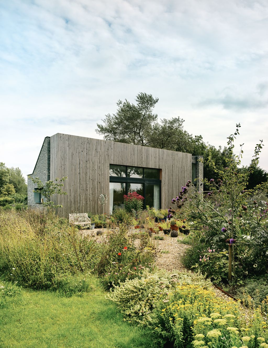 Image may contain Indoors Interior Design Grass Plant Architecture Building Outdoors Shelter Backyard and Nature