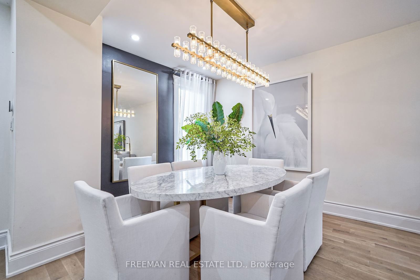 Image may contain Architecture Building Dining Room Dining Table Furniture Indoors Room Table Chandelier and Lamp