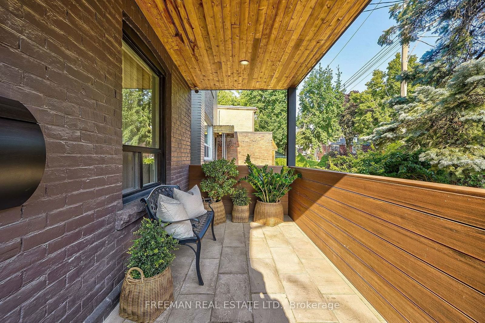 Image may contain Indoors Interior Design Architecture Balcony Building Plant Wood Bench Furniture and Accessories